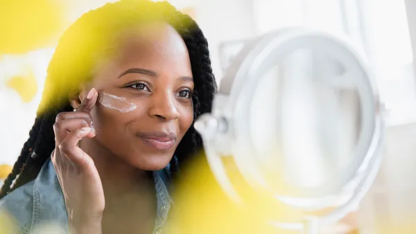 Woman Applying Skincare