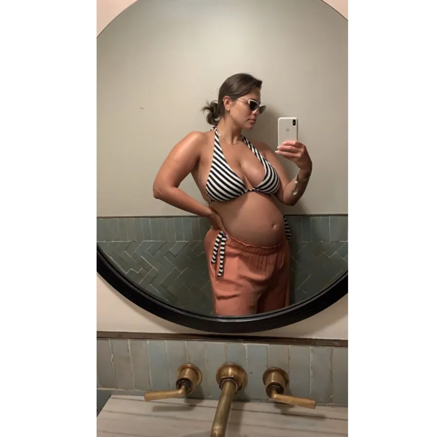 Ashley Graham Embraces Her Bare Baby Bump During 'Staycation' With Husband Justin Ervin