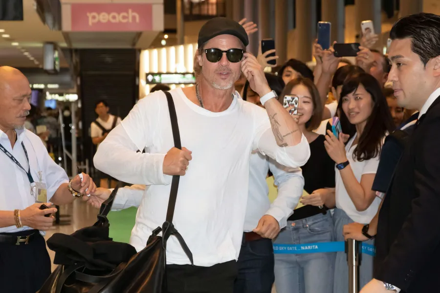 Brad Pitt Is All Smiles Arriving in Japan After Son Maddox's Comments About Their Tense Relationship