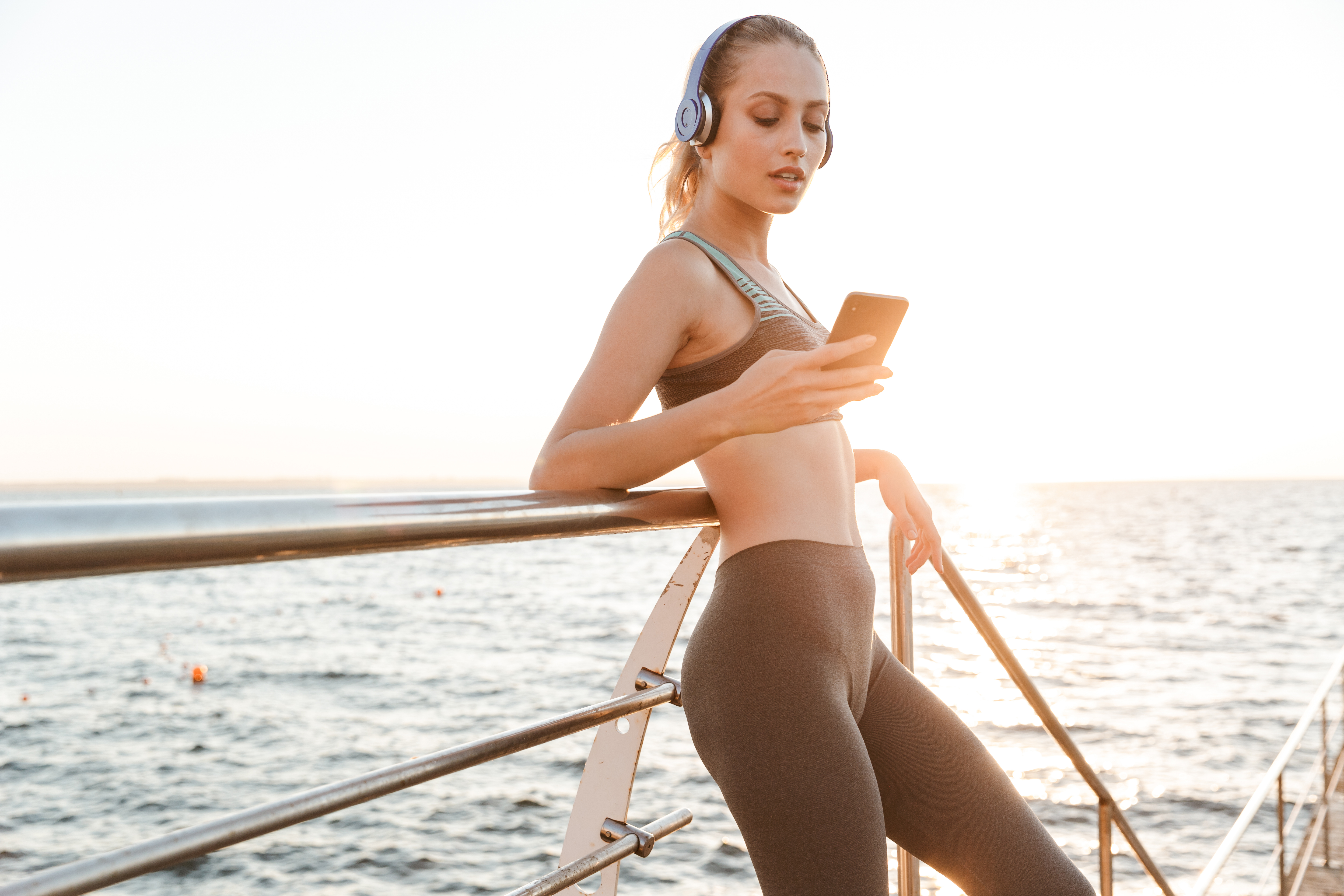 woman working out using phone noom