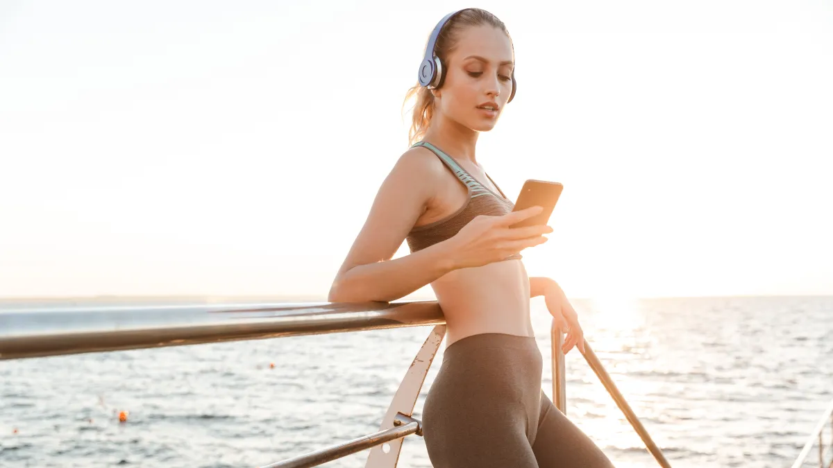 woman working out using phone noom