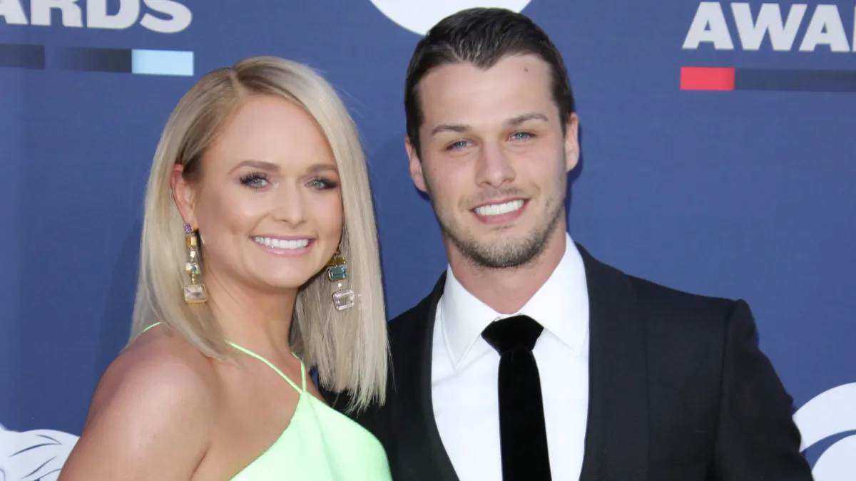 Miranda Lambert Giggles As Husband Brendan McLoughlin Helps Put on Her Boots Before Show