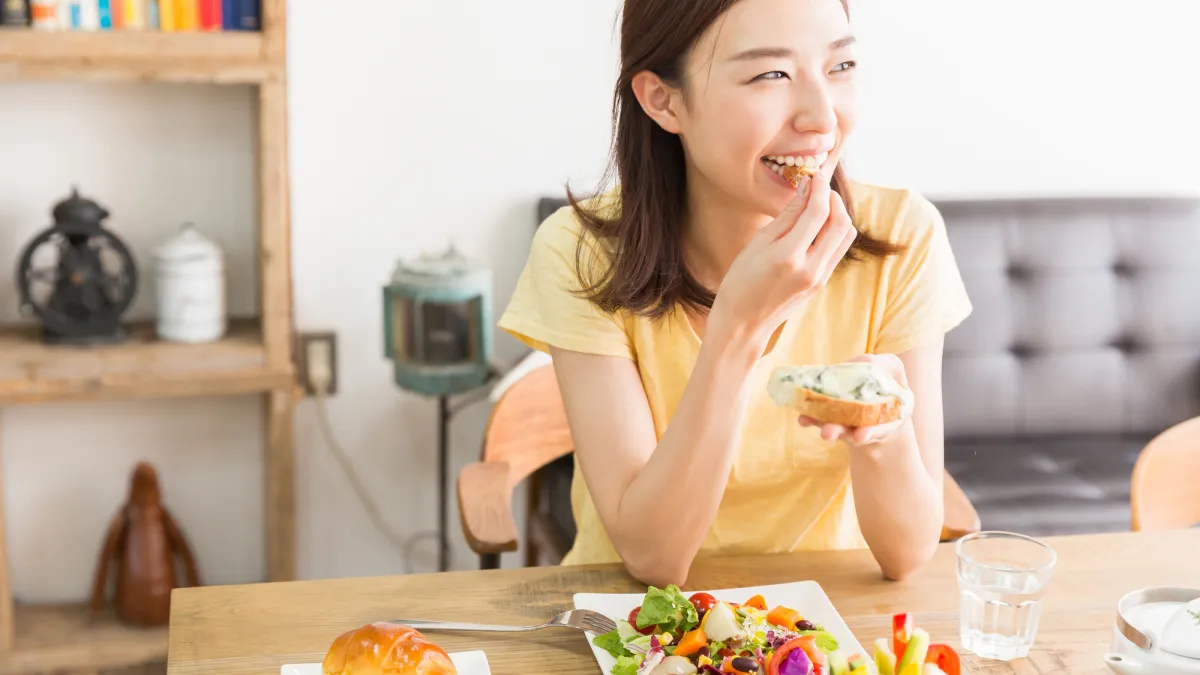 woman eating bread