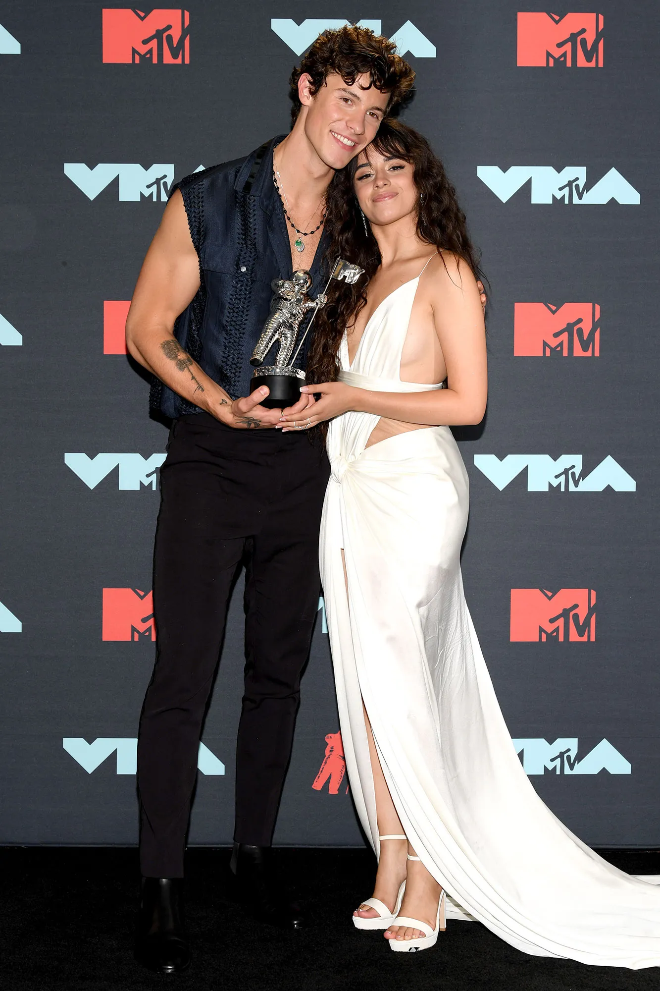Shawn Mendes and Camila Cabello Holding MTV Award
