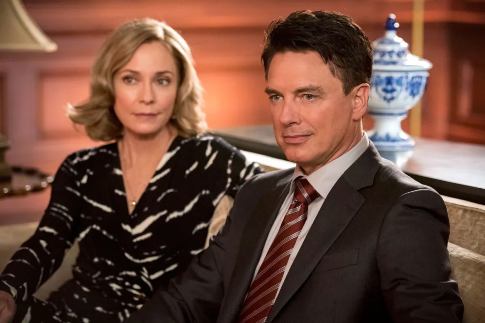 Susanna Thompson as Moira Queen and John Barrowman as Malcolm Merlyn Arrow Recap Arrowverse
