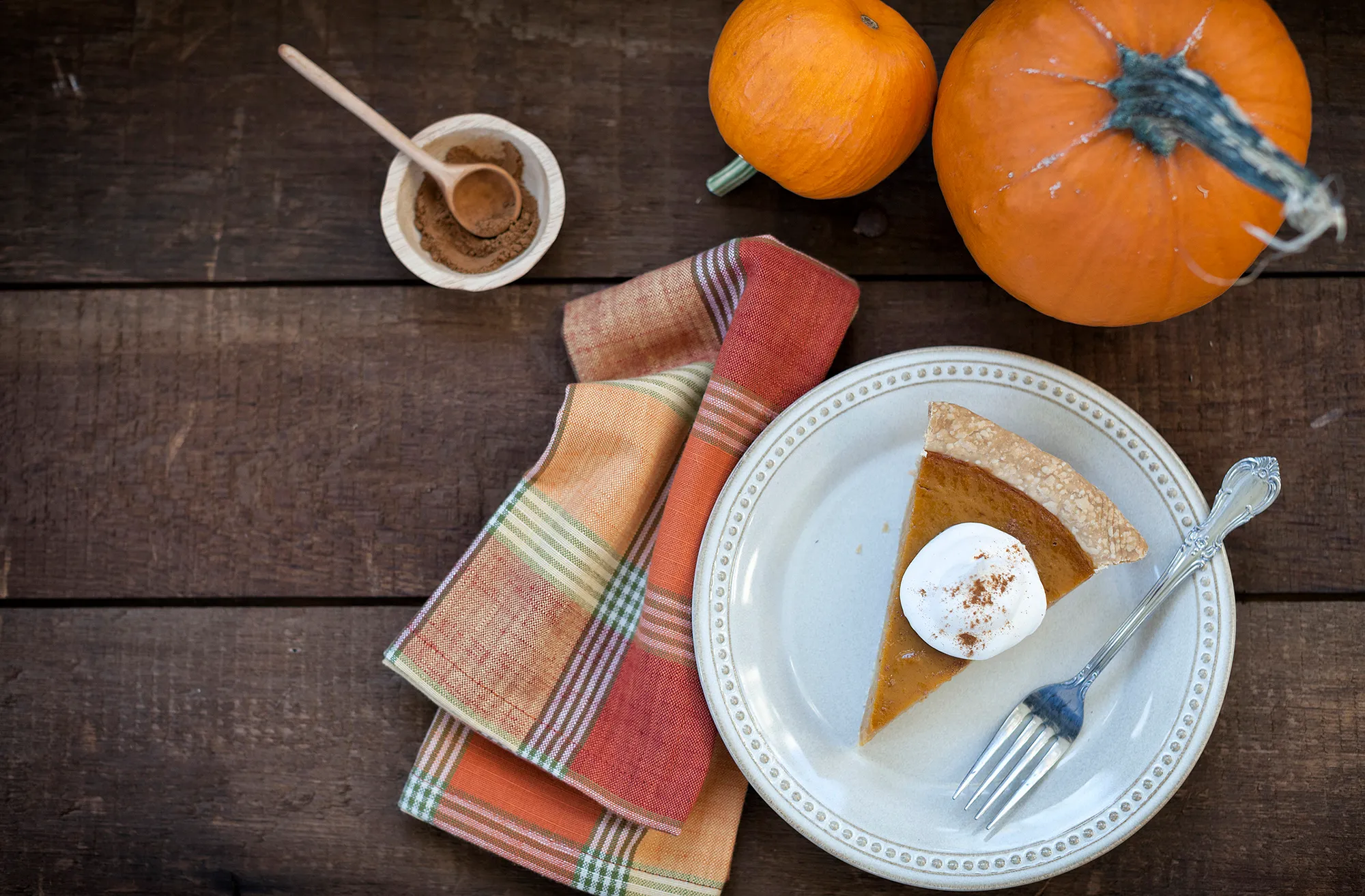 Holiday pumpkin pie with whipped topping.