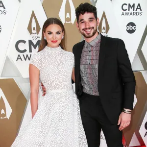 Hannah Brown and Alan Bersten 2019 CMA Awards Arrival Red Carpet White Dress