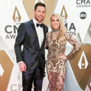 Mike Fisher and Carrie Underwood PDA Arrival Red Carpet 2019 CMA Awards
