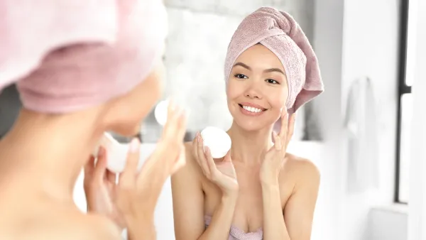 woman applying face cream