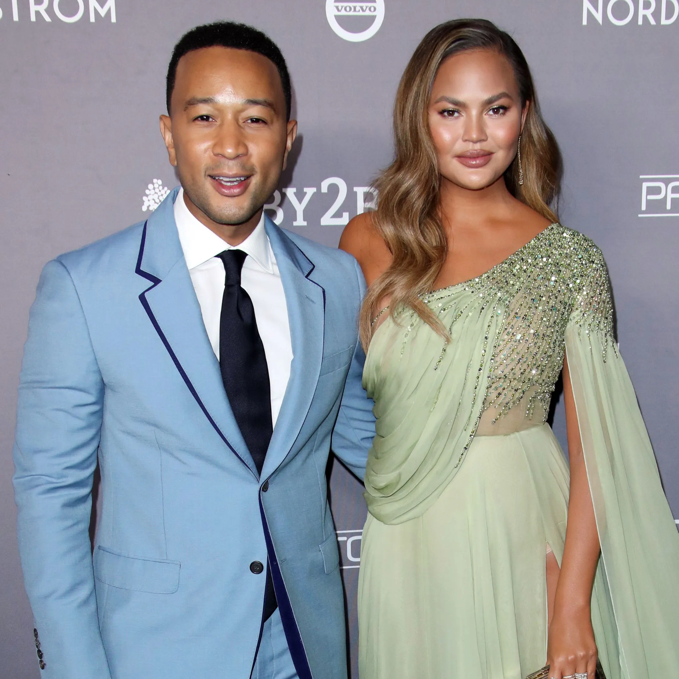 Chrissy Teigen Falls in Hilarious Ice Skating Video With John Legend