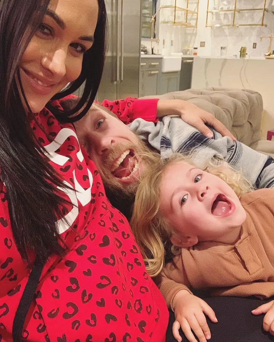 Brie Bella Baby Bump with Husband and Daughter