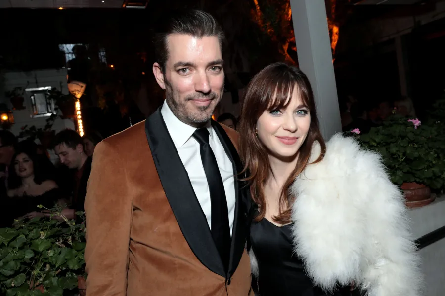 Jonathan Scott and Zooey Deschanel attend the CAA Pre-Oscar Party