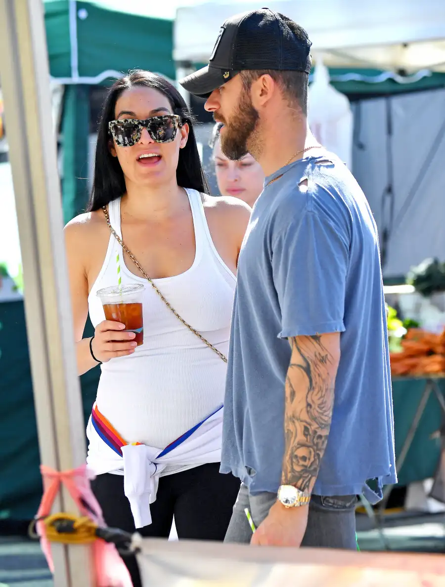 Nikki Bella Kisses Fiance Artem Chigvintsev While Showing Off Baby Bump