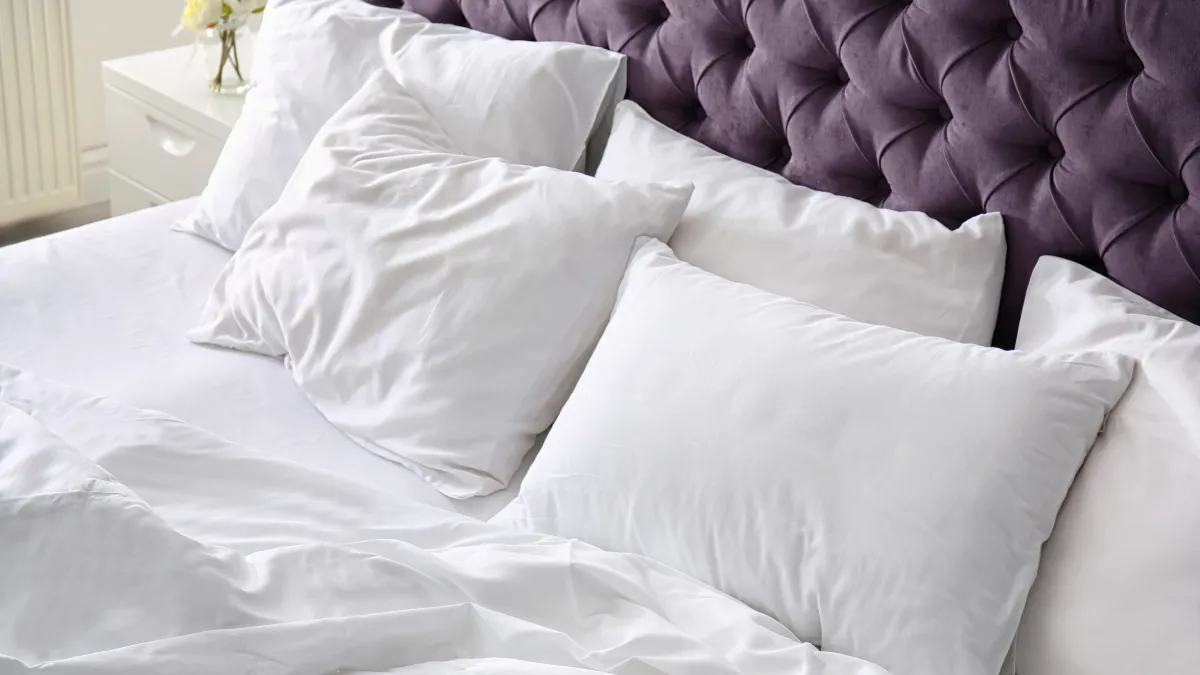 Bed with pillows and comforter