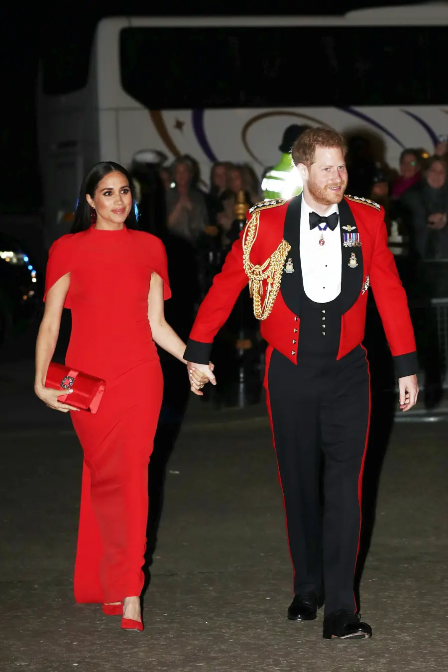 Prince Harry and Duchess Meghan Hold Hands in Matching Red at Festival of Music