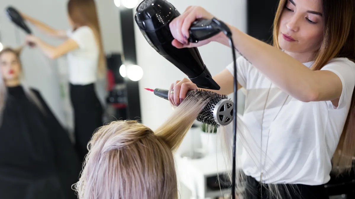 woman getting a blowout at salon