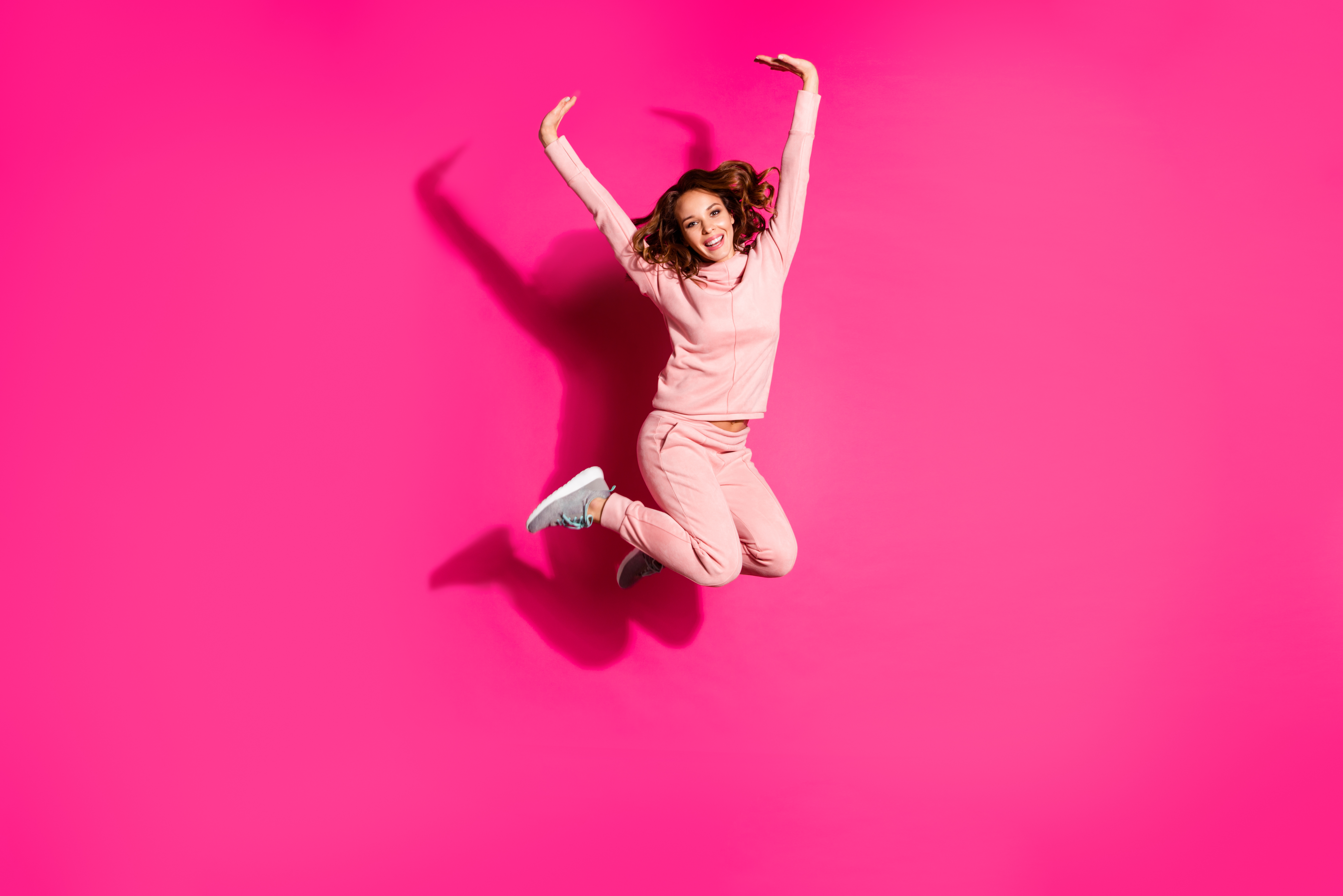 girl in sweats and sneakers stock photo