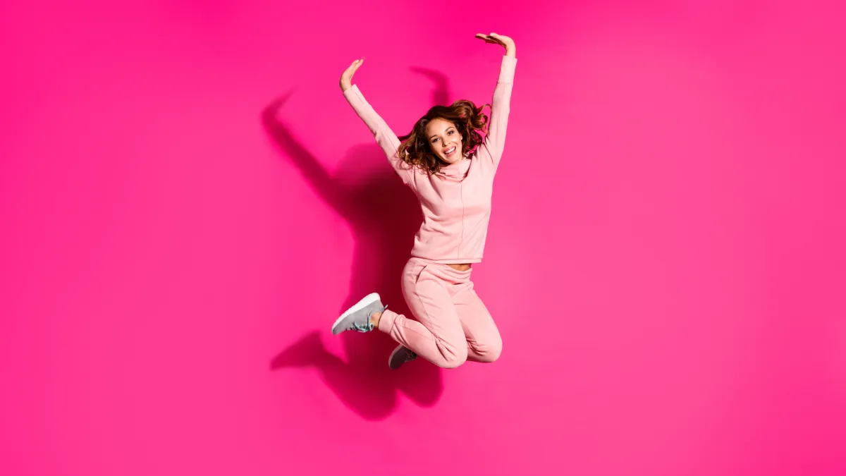 girl in sweats and sneakers stock photo
