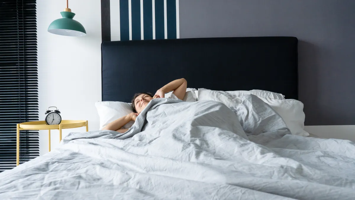 sleeping in bed stock photo