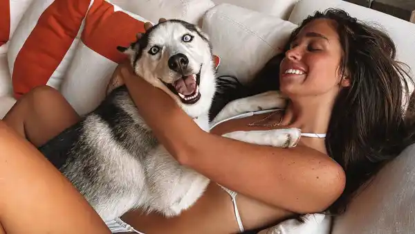 Ariana Biermann Cuddles with a Dog in a Bikini Mom Kim Zolciak Designed