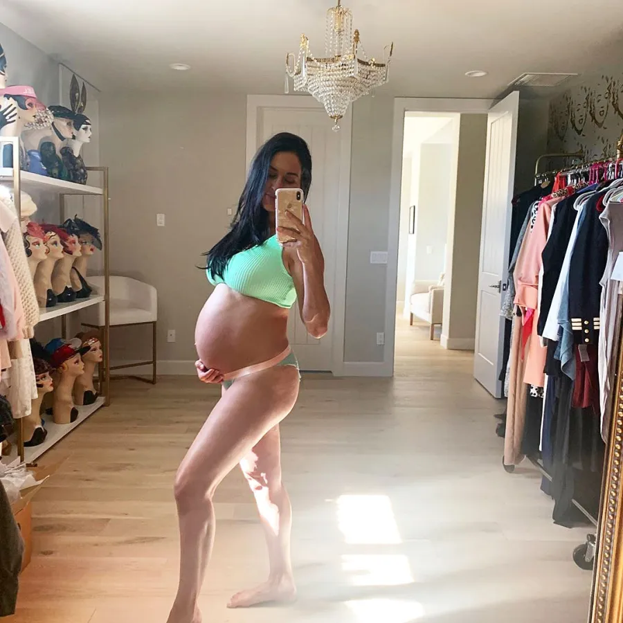 Nikki Bella Baby Bump Feels Outline of Babys Feet