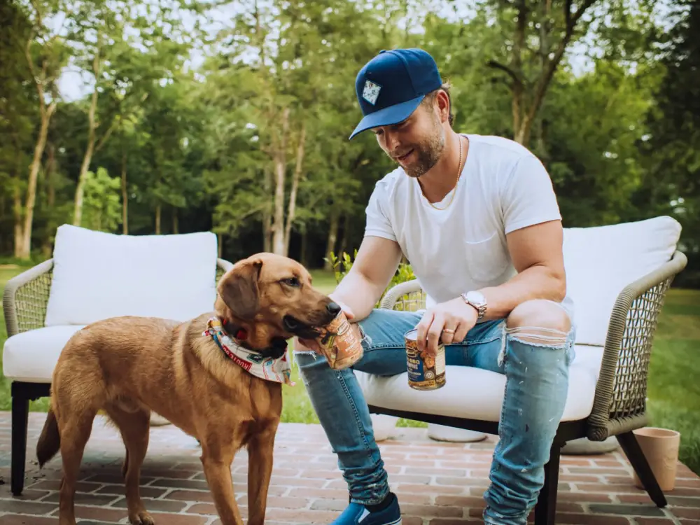 Chris Lane with Cooper for New Merrick BBQ