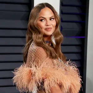 Chrissy Teigen Slams Claims She Dropped 50 Pounds Has Cancer