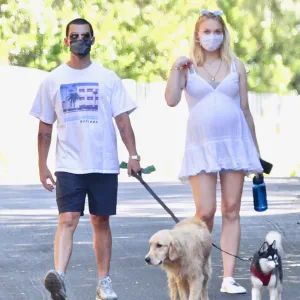 Pregnant Sophie Turner Cradles Her Baby Bump on a Walk With Joe Jonas