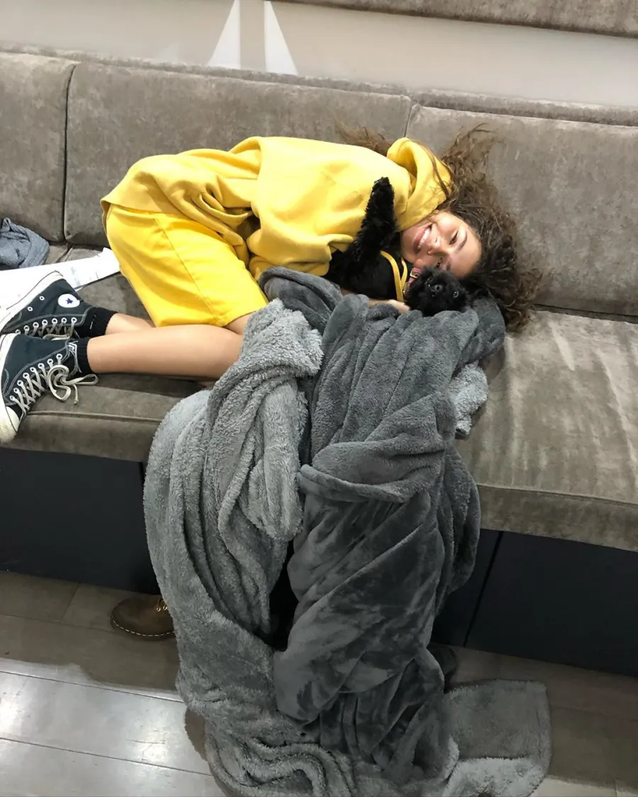 Zendaya on couch with dog