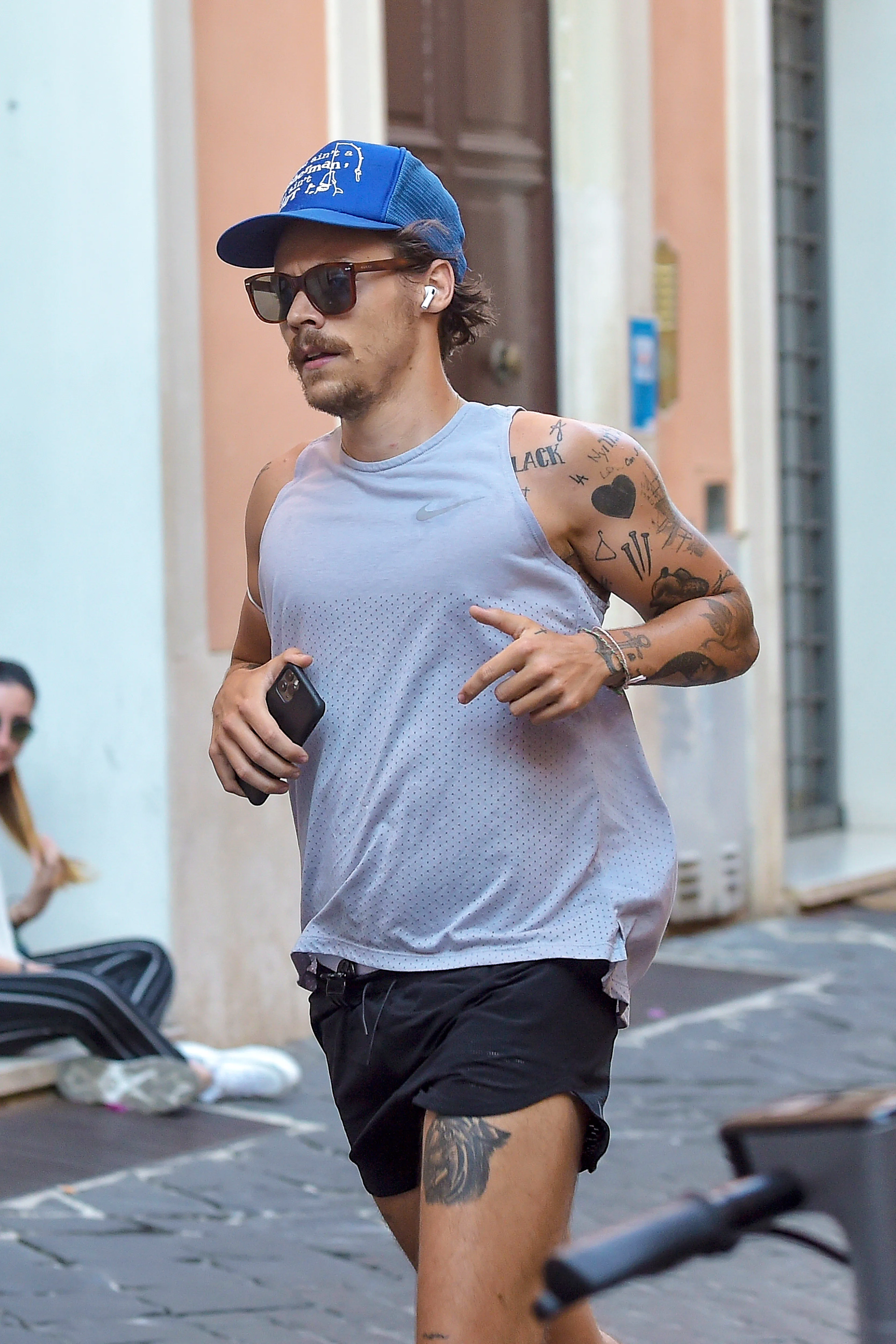 Harry Styles Sports 70s-Inspired Quarantine Mustache While Jogging In Rome
