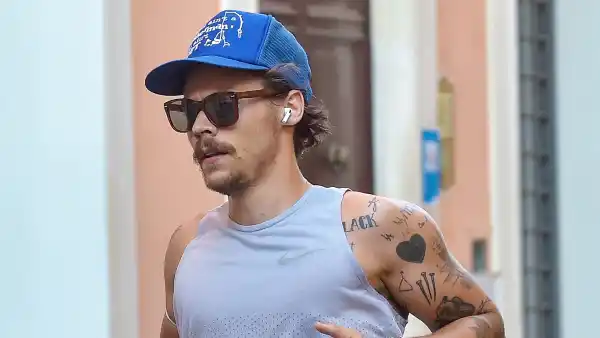 Harry Styles Sports 70s-Inspired Quarantine Mustache While Jogging In Rome