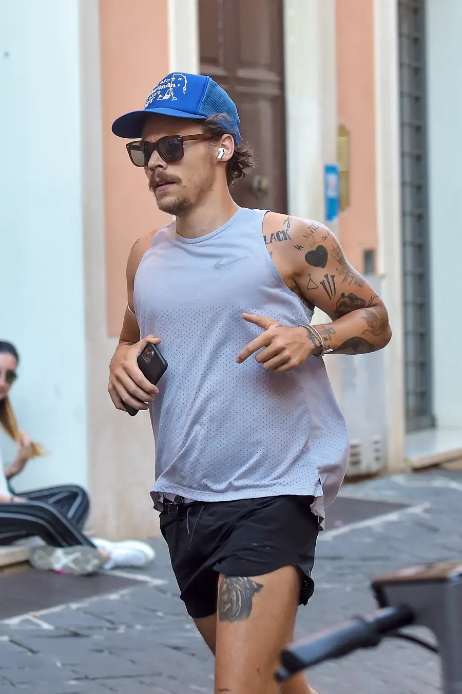 Harry Styles Sports 70s-Inspired Quarantine Mustache While Jogging In Rome