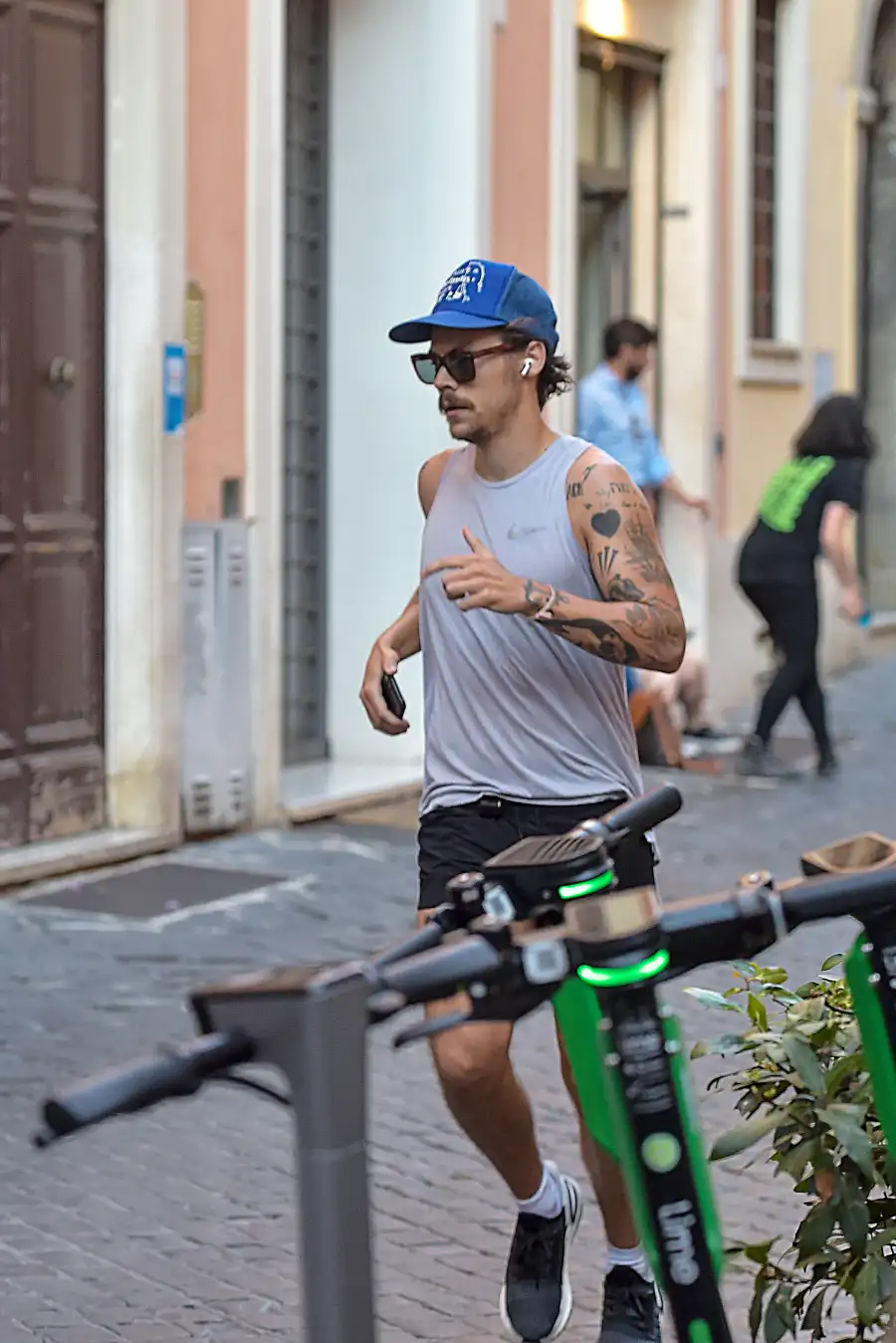 Harry Styles Sports 70s-Inspired Quarantine Mustache While Jogging In Rome