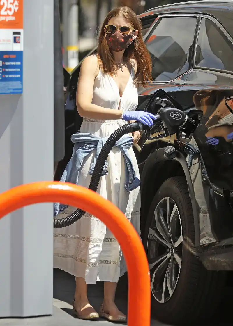 Kate Mara pumping gas