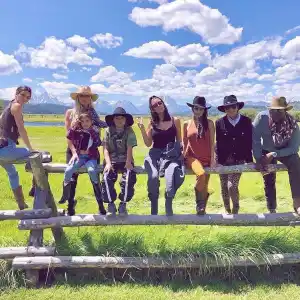 Kim Kardashian Enjoys Family Time Ahead of Her 40th Birthday Family Sitting Fence