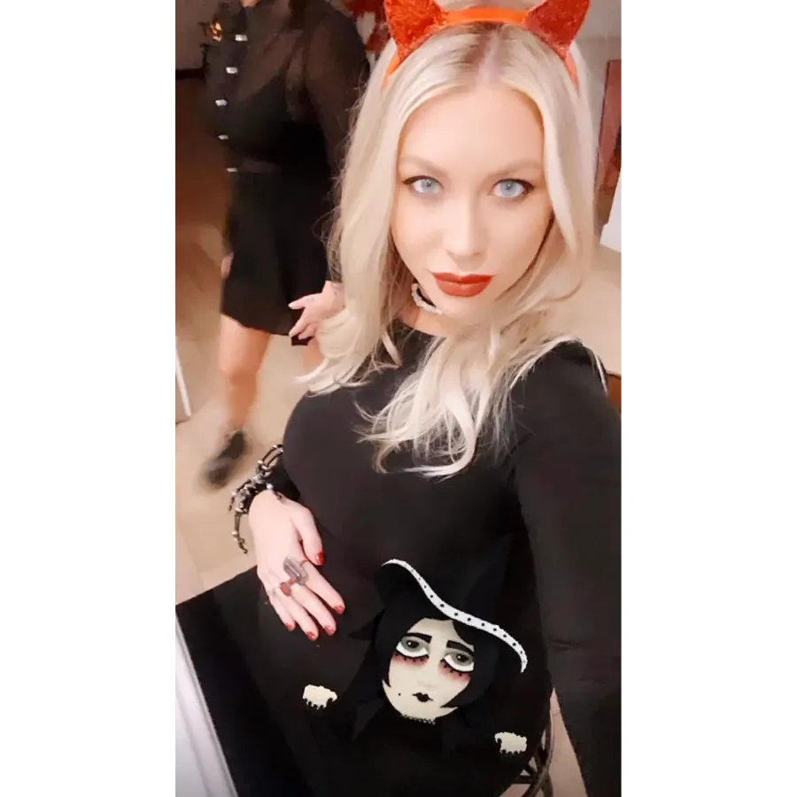 Pregnant Stassi Schroeder Wearing A Black Dress and Devil Ears
