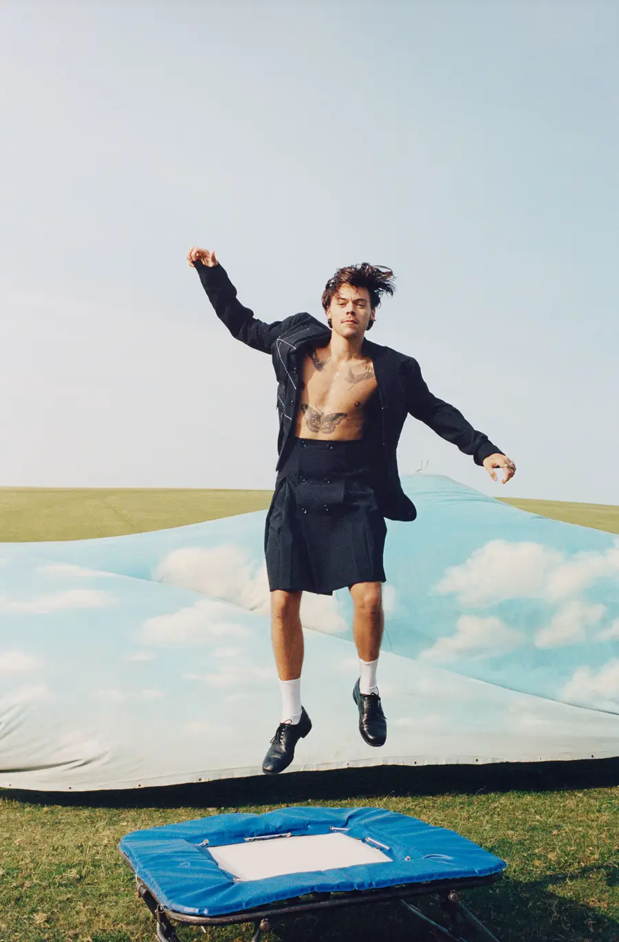 Harry Styles Wears a Ballgown as the First Male Vogue Cover Star