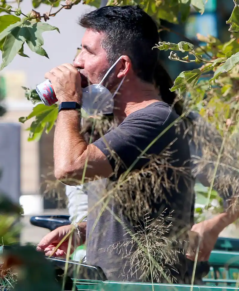 Simon Cowell drinking