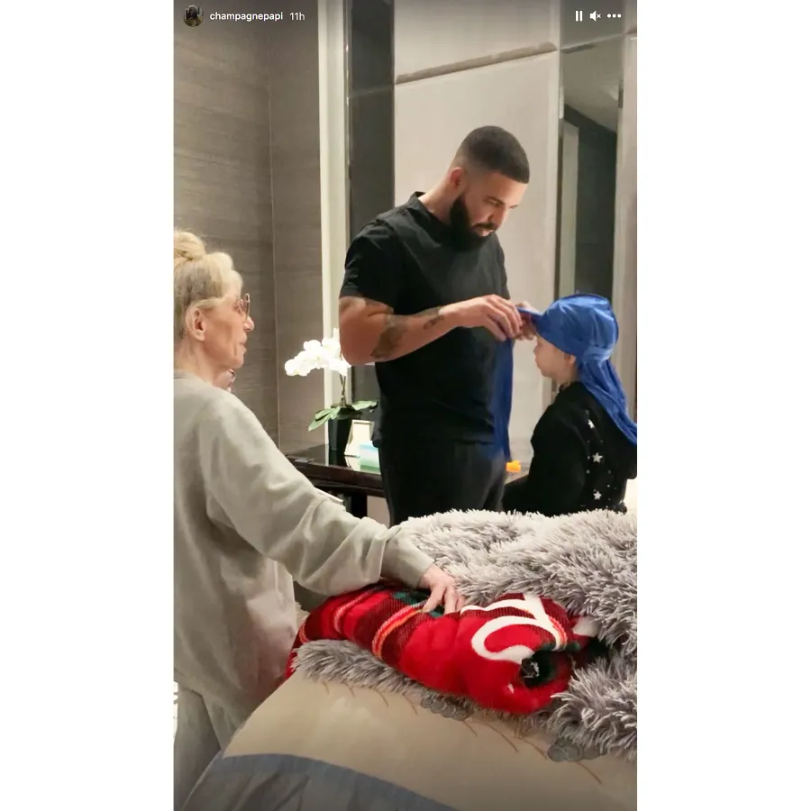Drake Helps His Son Adonis Get Dressed