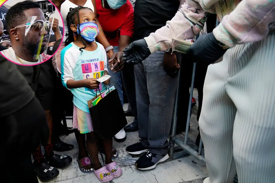 Sean Diddy Combs passes out fifty dollar bills in Miami
