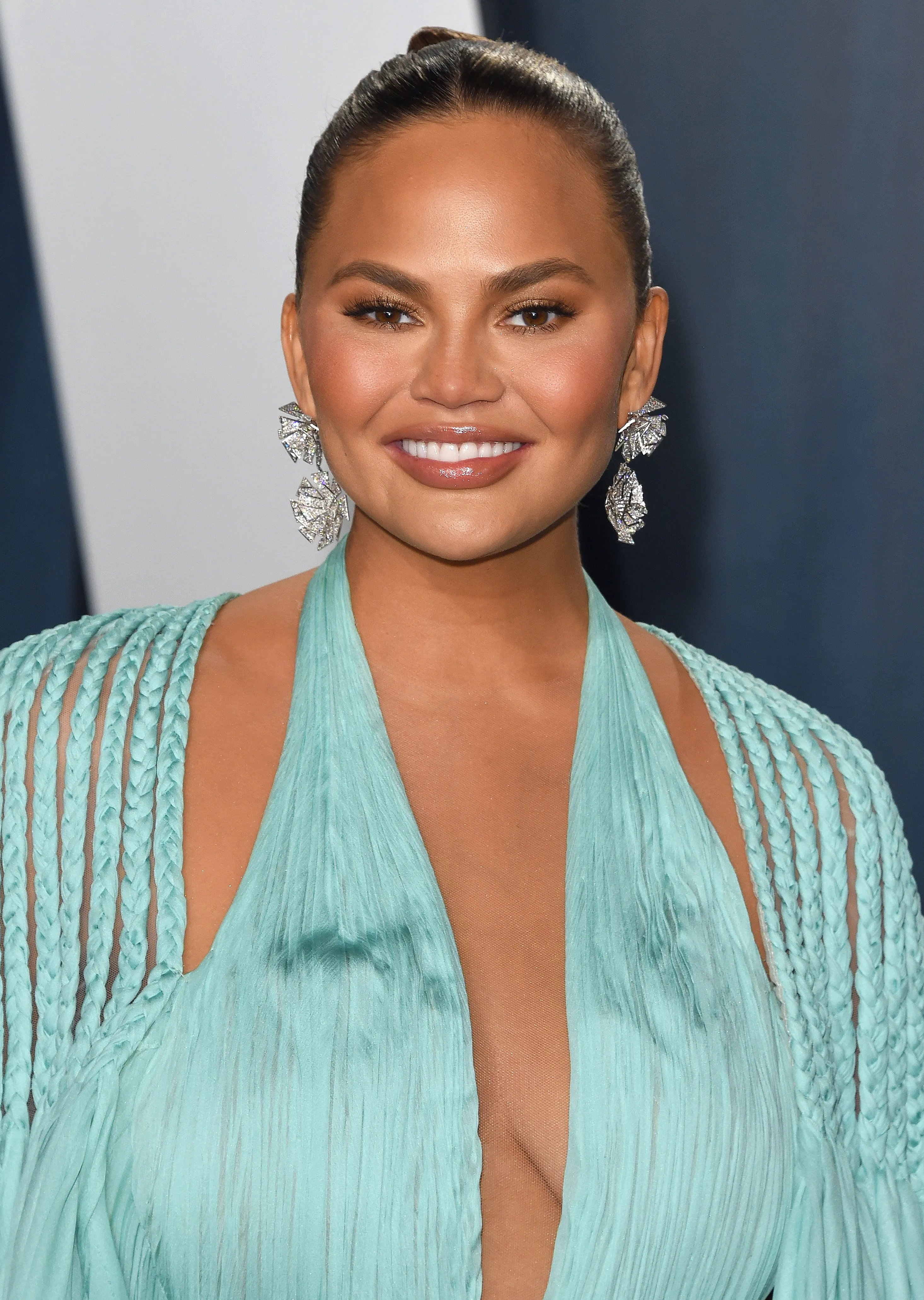 You’ll Never Guess the Meaning Behind Chrissy Teigen's Sexy Spine Tattoo