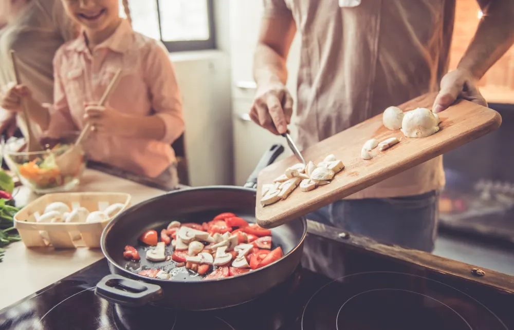 Cooking-Food-In-Kitchen-Stock-Photo