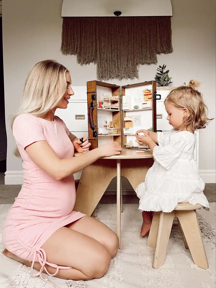 Lauren Burnham and Alessi Luyendyk Playing With a Dollhouse