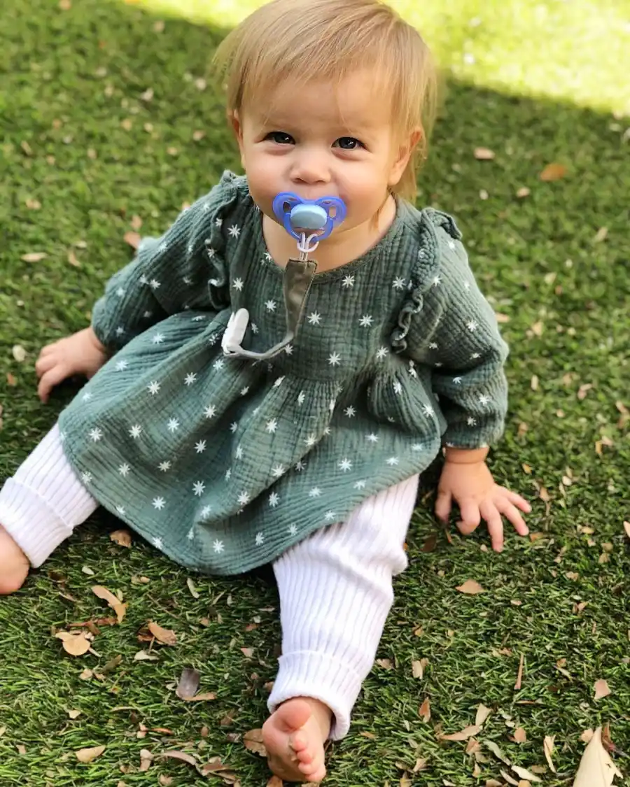 Mia Sitting in the Grass Catherine Giudici and Sean Lowe Family Album