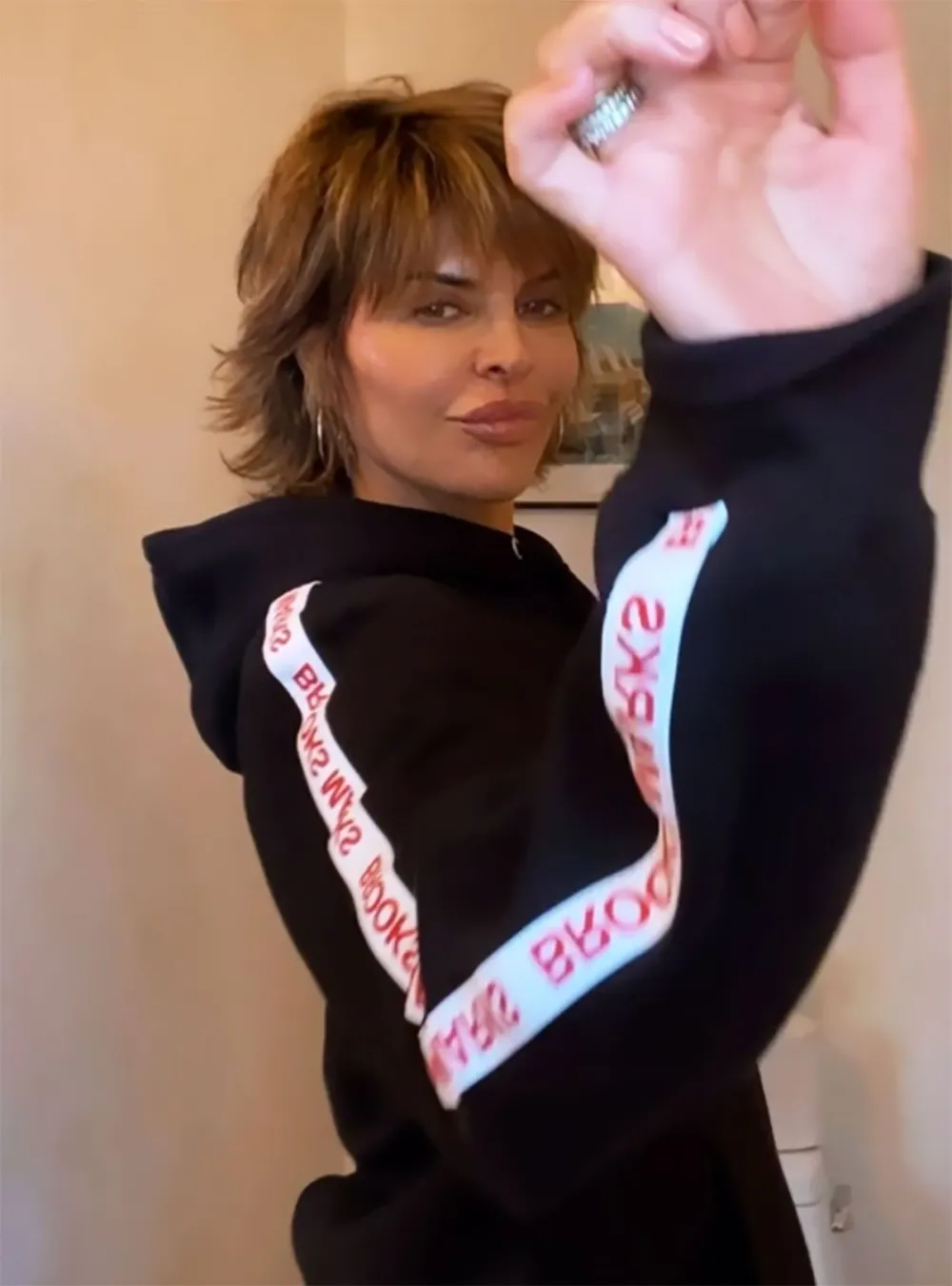 Lisa Rinna Dances in RHSLC&rsquo;s Brooks Marks&rsquo; Tracksuit &mdash; Watch!