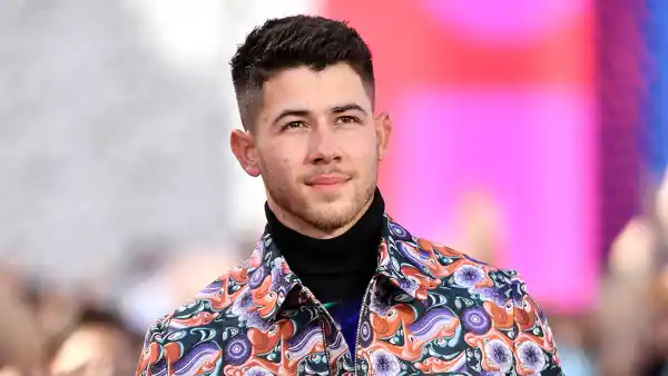 Nick Jonas Surprises Fan Wearing Jonas Brothers Shirt on Street