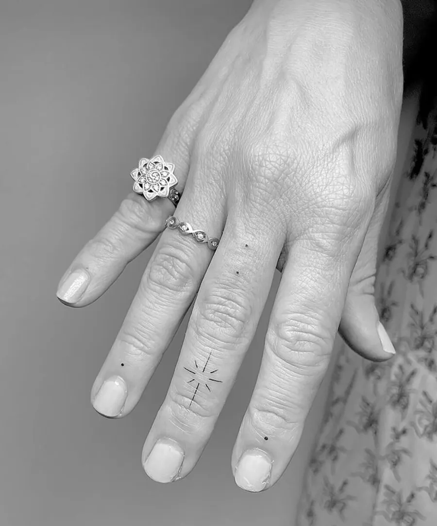 RHONJ’s Dina Manzo Is an ‘Elevated Witch’ With Magical Finger Tattoo