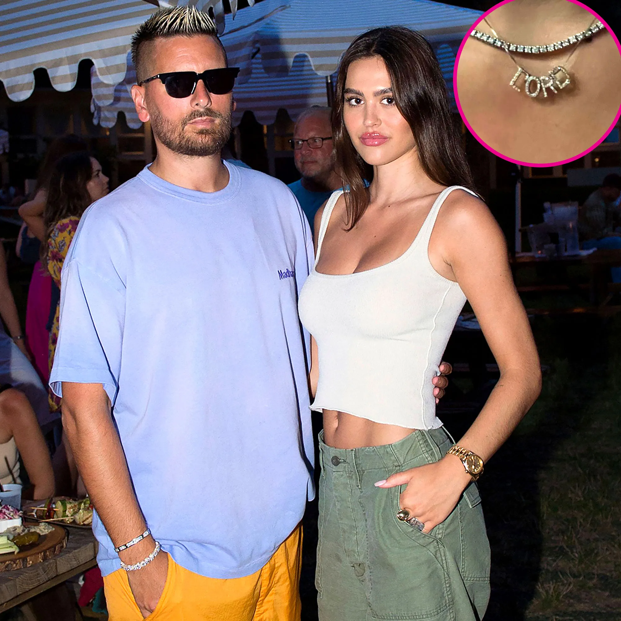 Amelia Hamlin Has a Diamond ‘Lord’ Necklace in Honor of Scott Disick blue shirt, white top, green pants, gold watch