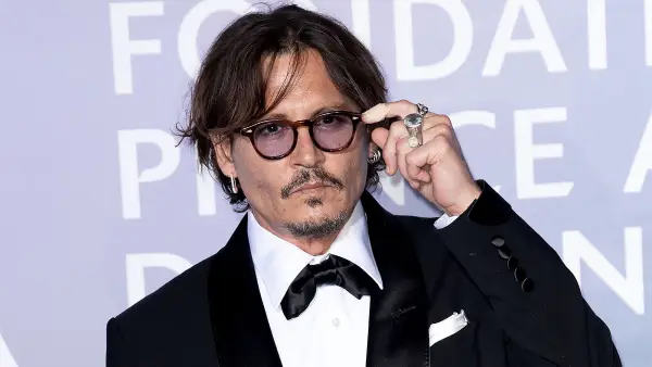 Johnny Depp and Amber Heard's Legal Drama black suit glasses