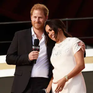 Meghan Markle leans on Prince Harry at Global Citizen